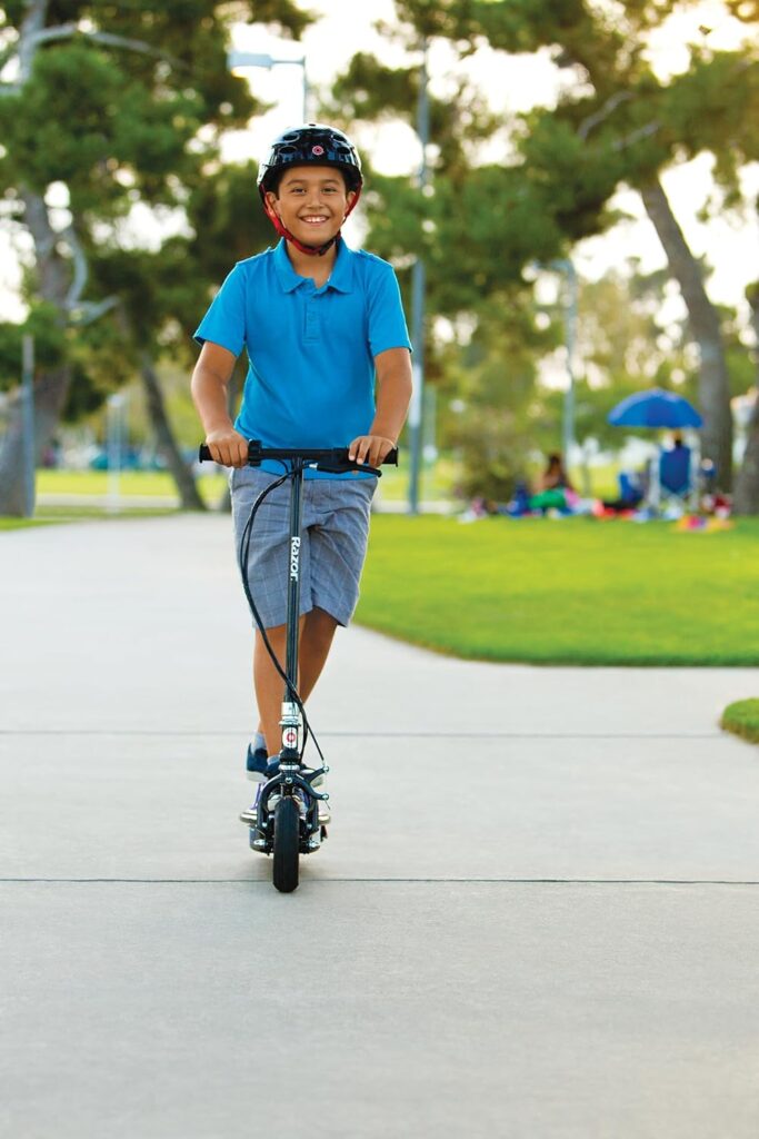 Razor E100 Glow Electric Scooter for Kids Age 8 and Up, LED Light-Up Deck, 8 Air-filled Front Tire, Up to 40 min Continuous Ride Time